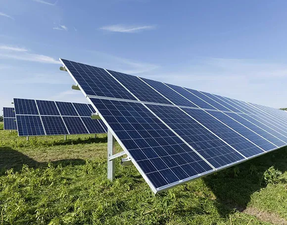 Close-up angled view of commercial solar panels installed on a field.