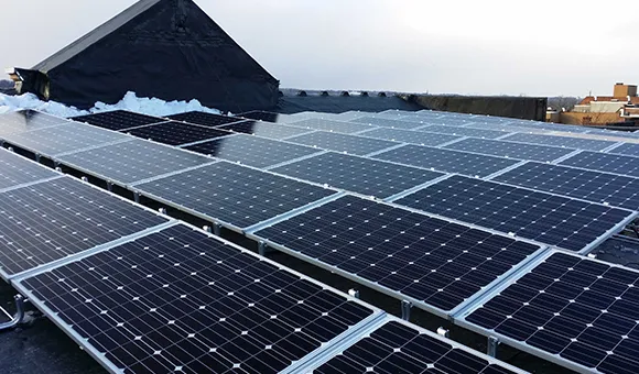 Solar panels installed on rooftop at a commercial or residential building in Atlanta, GA